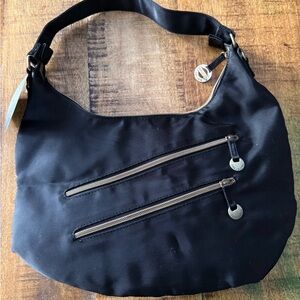 Travelon Black Hobo Bag with Dual Zipper Design and removable crossbody strap